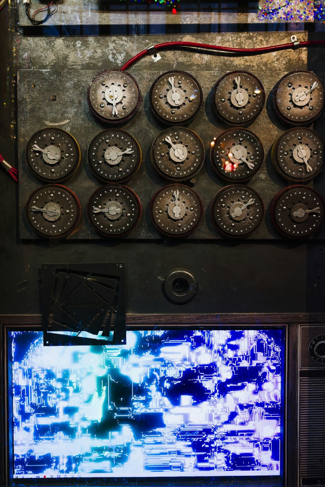 Vintage television control room with analog broadcast equipment and glowing monitors